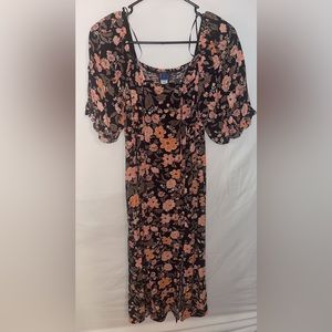 Navy& floral puff sleeve dress. There is a slit at the bottom in the front